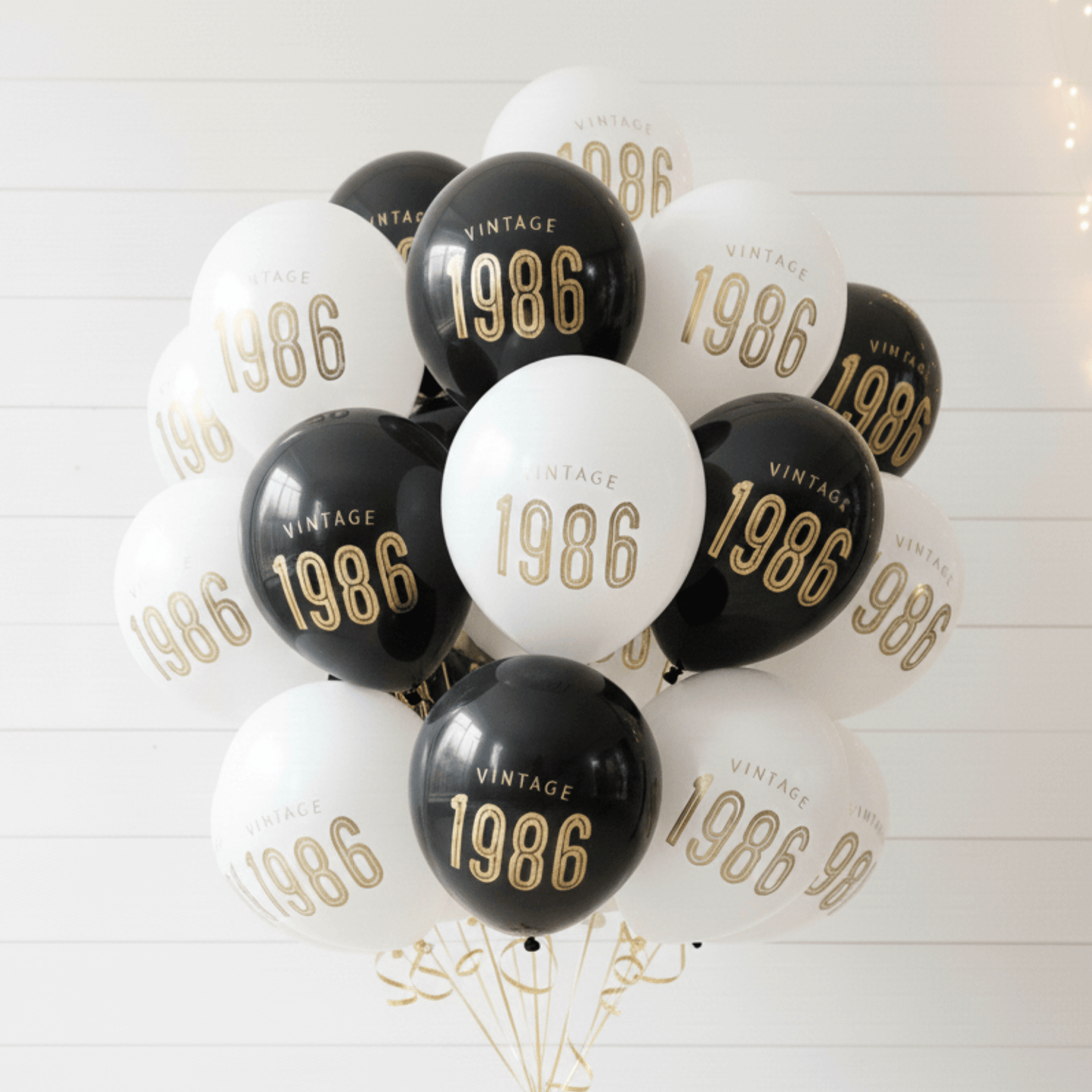 40th Birthday Balloons-Bouquet of balloons with '1986' printed on them against a white background