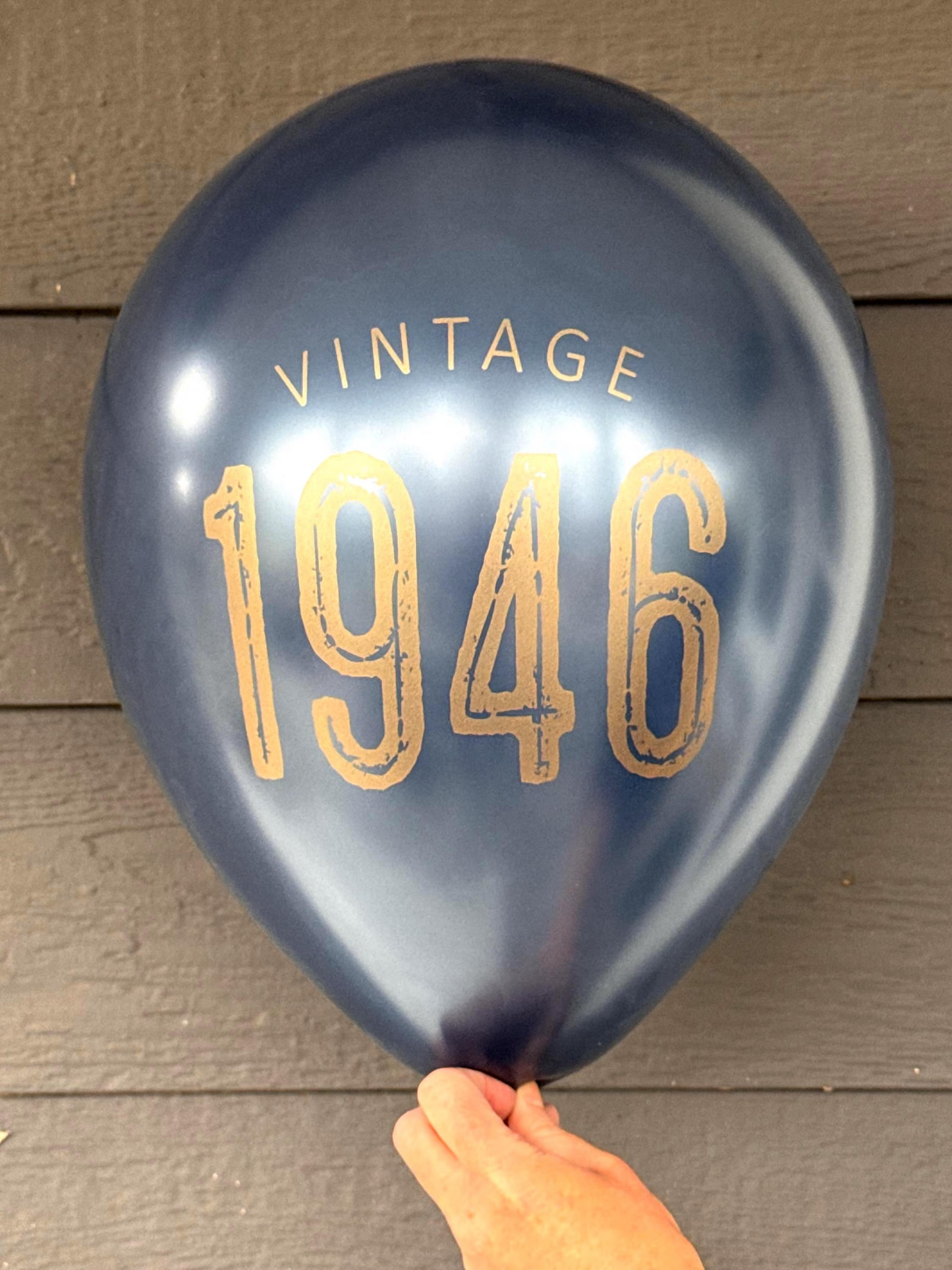 80th Birthday Balloons Navy with gold lettering reading Vintage 1946