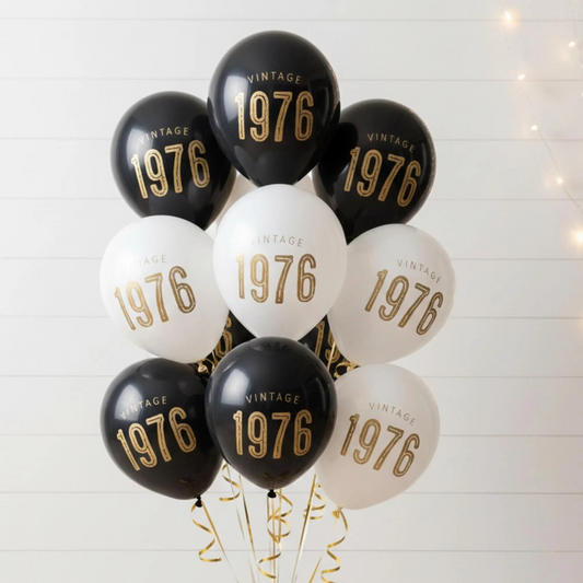50th Birthday balloons.  A balloon bouquet of black and white balloons that read Vintage 1976 in bold font.  Perfect 50th Birthday Decor for a milestone celebration