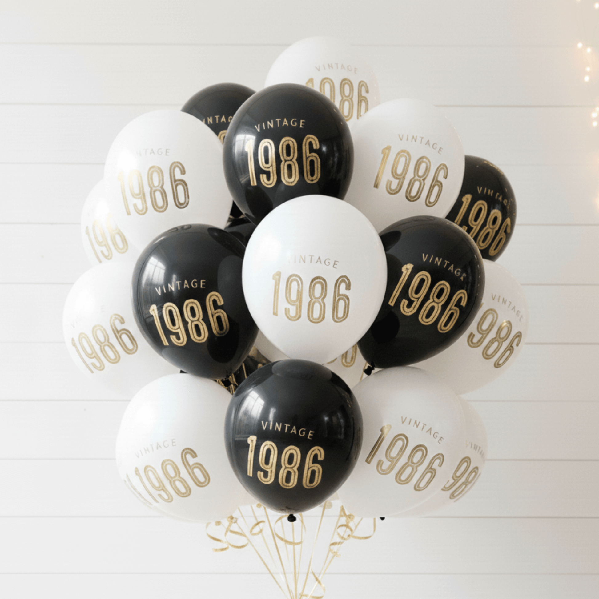 40th Birthday Balloons-Bouquet of balloons with '1986' printed on them against a white background
