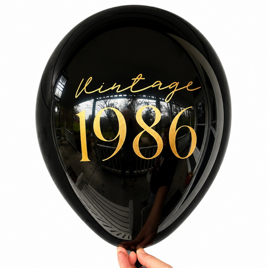 40th Birthday Balloons.  The balloon is black with gold font.  The balloon reads Vintage 1986.  Perfect 40th Birthday Decorations