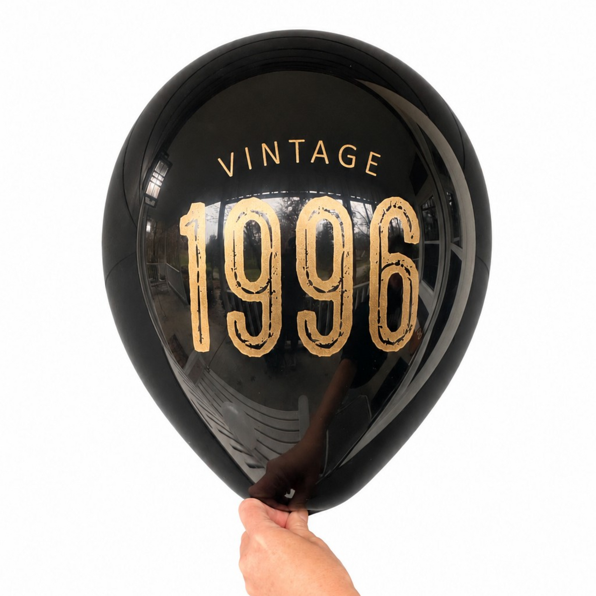 30th Birthday Balloons.  The balloon is black latex with gold metallic ink.  The balloon reads Vintage 1996.