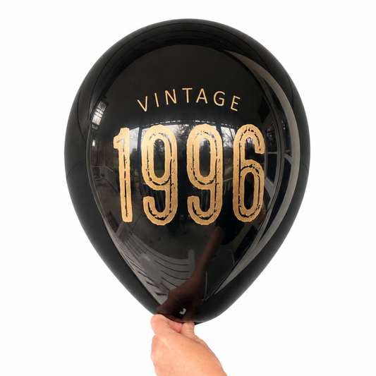 30th Birthday Balloons.  The balloon is black latex with gold metallic ink.  The balloon reads Vintage 1996.