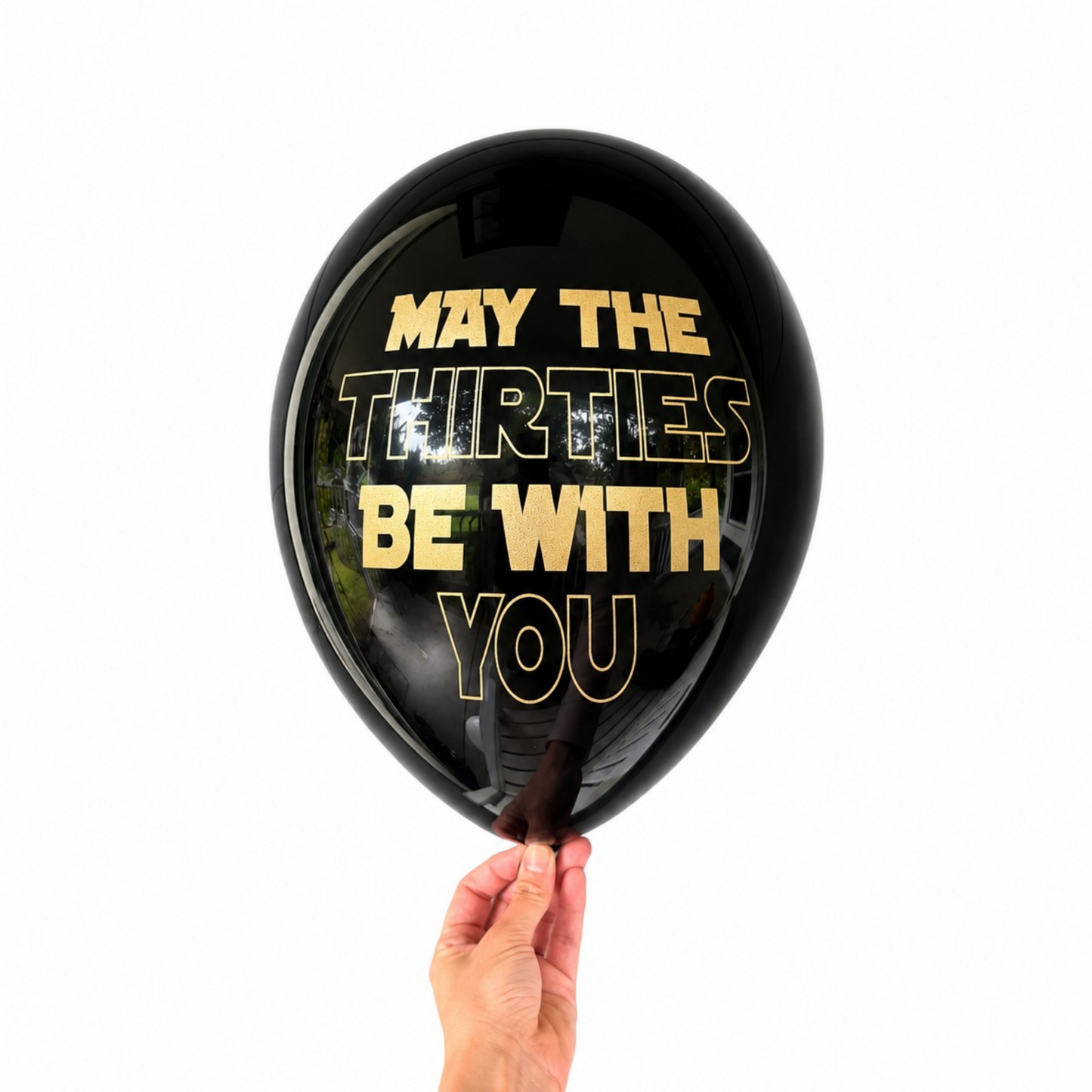 12 inch black latex balloon that reads may the thirties be with you in a gold metallic font.
30th birthday balloons
