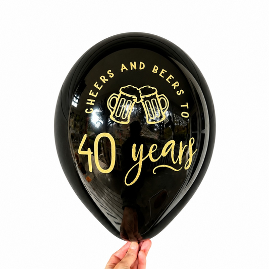 40th Birthday Balloons.  the balloon is black with gold text and read cheers and beers to 40 years with two beer mugs.  40th Birthday Decorations