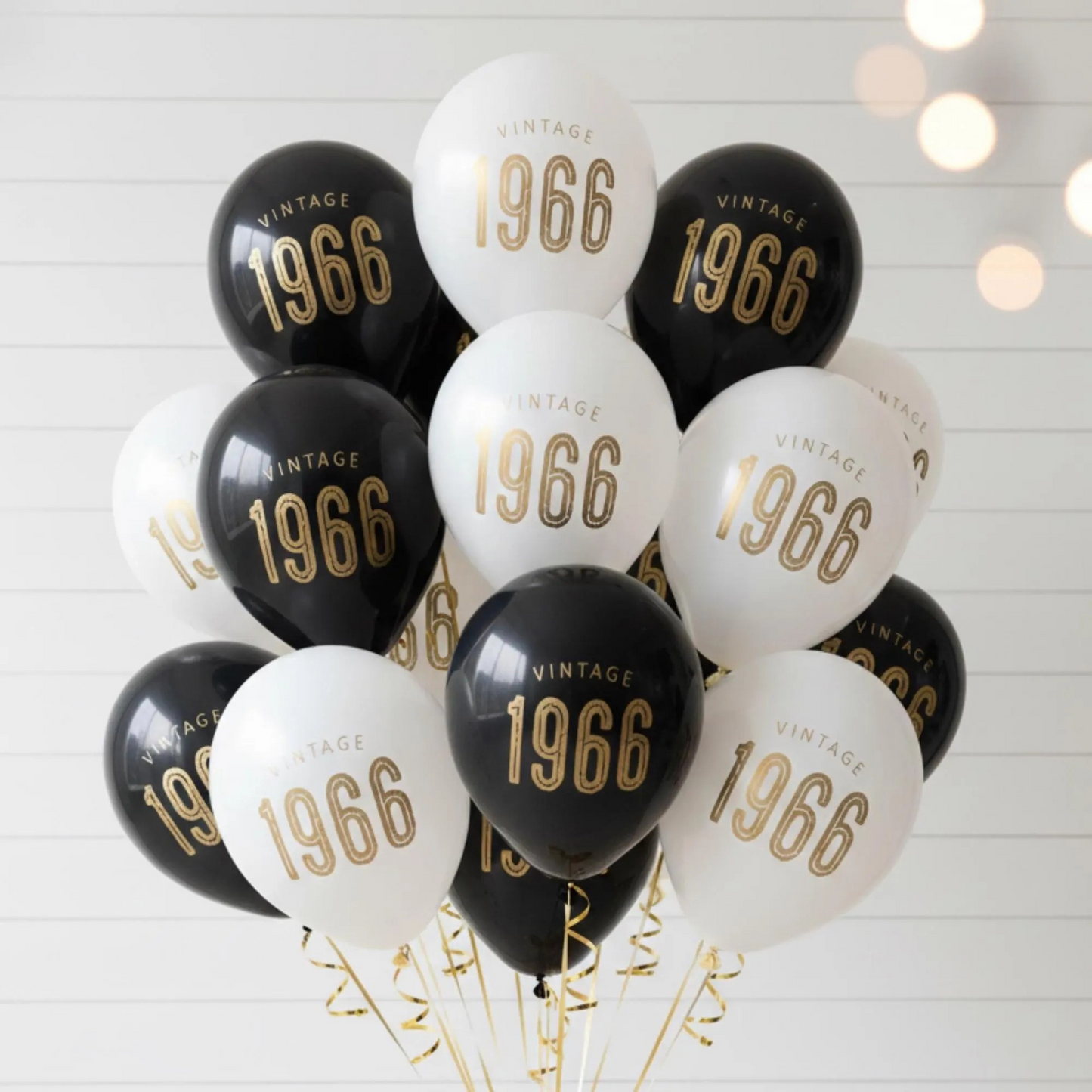60th Birthday Balloons Black White with gold text, latex.  The balloons read Vintage 1966