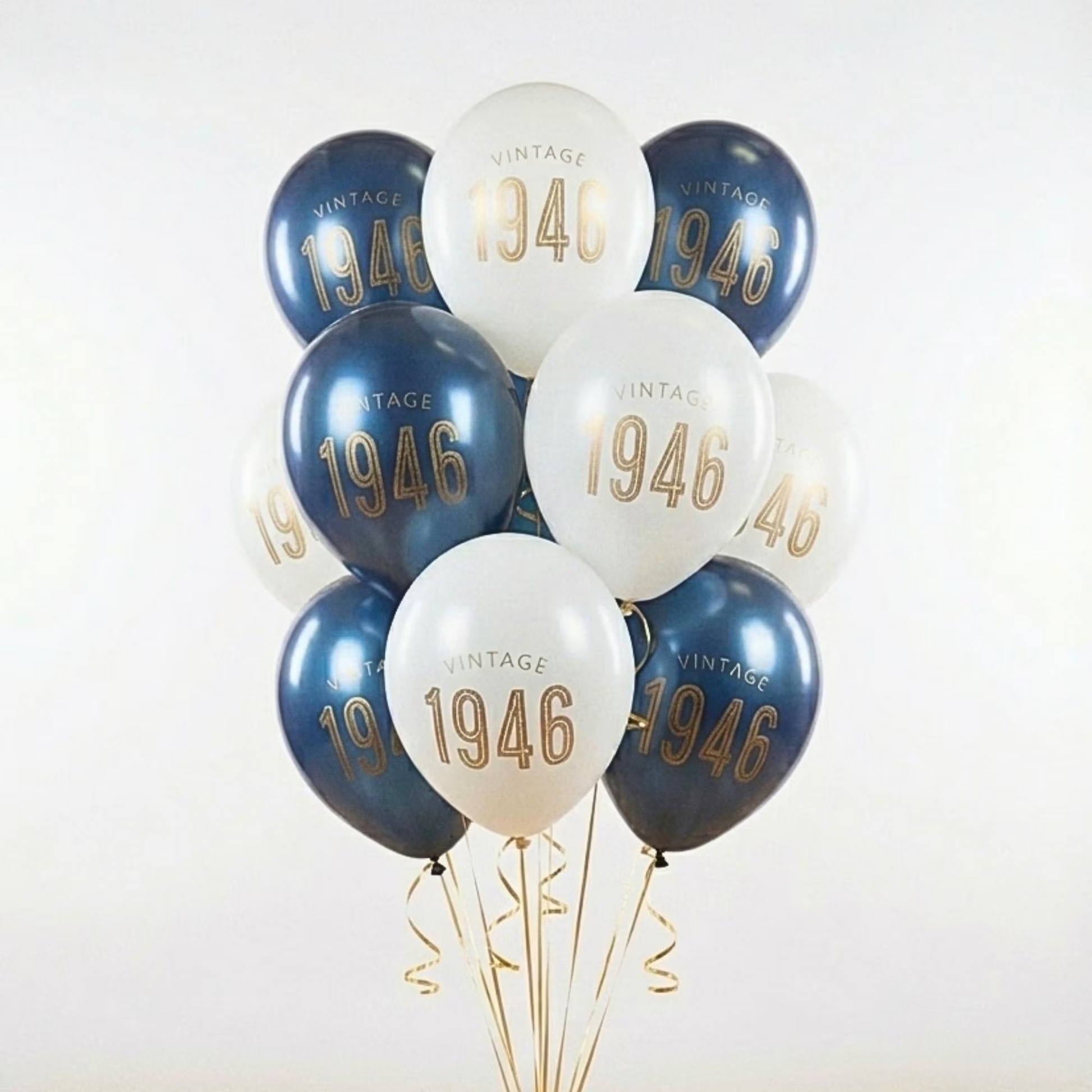 80th Birthday Balloons that read vintage 1946 in gold text.  the balloons are navy and white