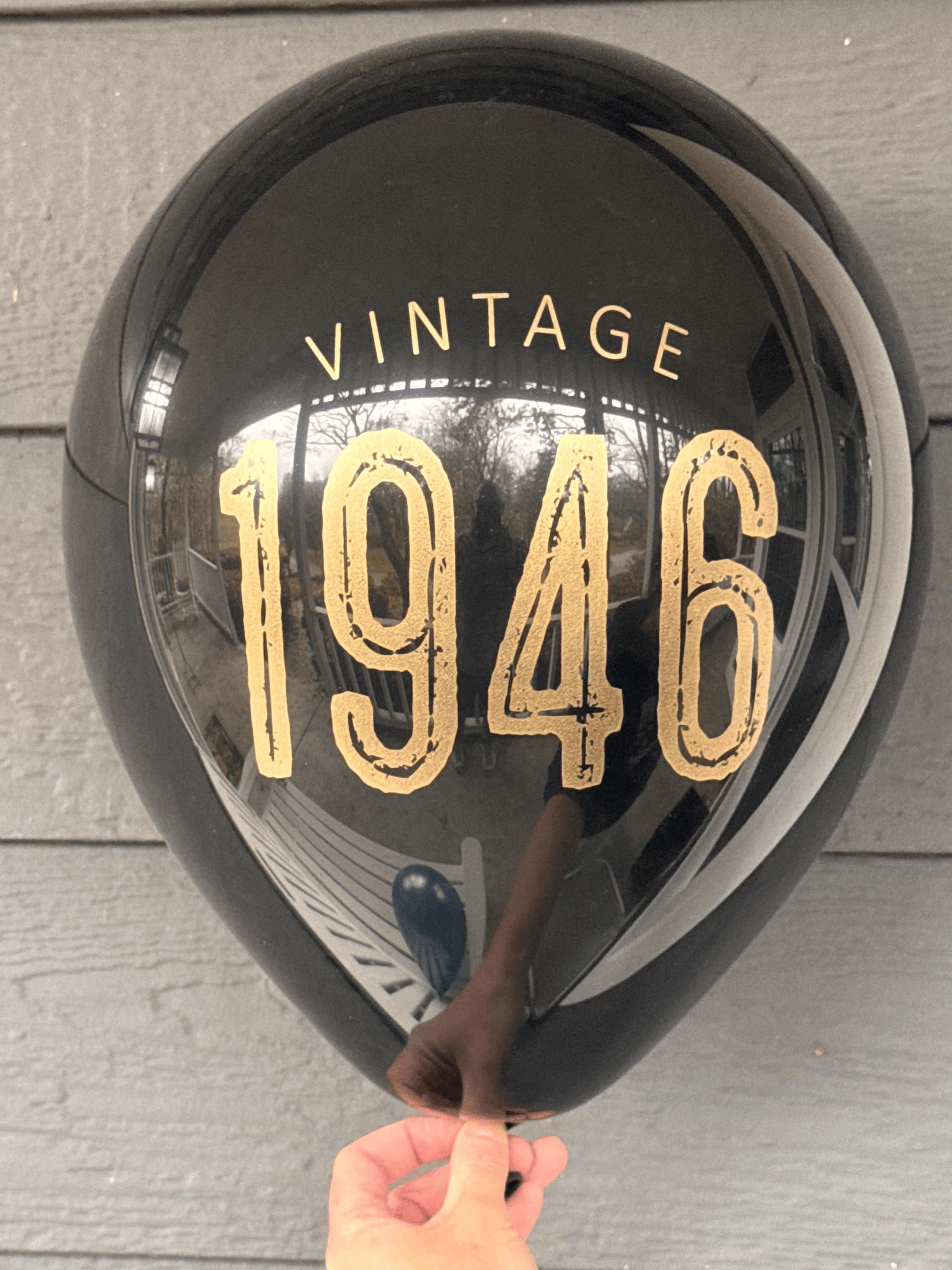 80th Birthday Balloons Black with gold lettering reading Vintage 1946