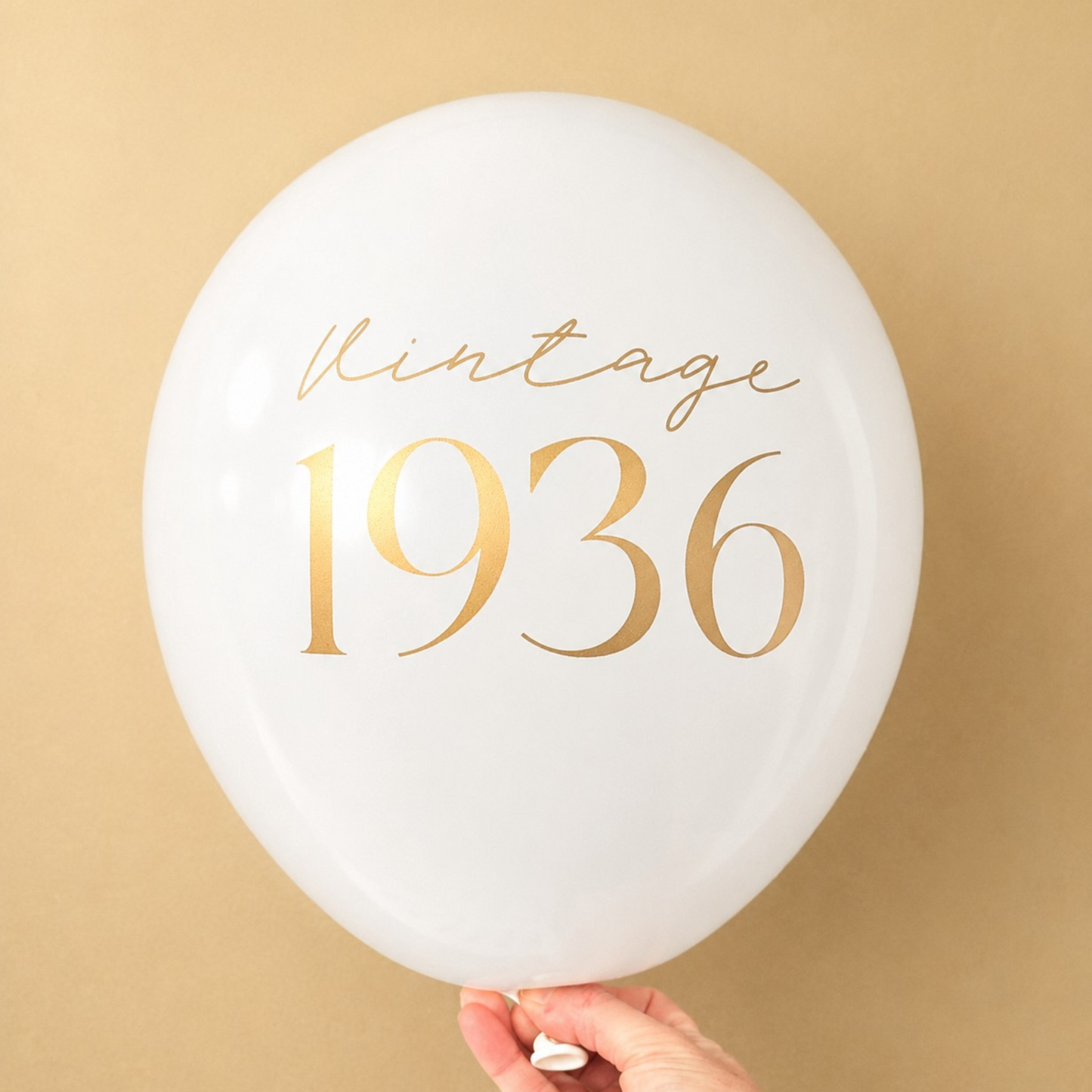 90th Birthday Balloons.  The Balloon is white with gold text and reads Vintage 1936.  Perfect 90th Birthday Party Decor