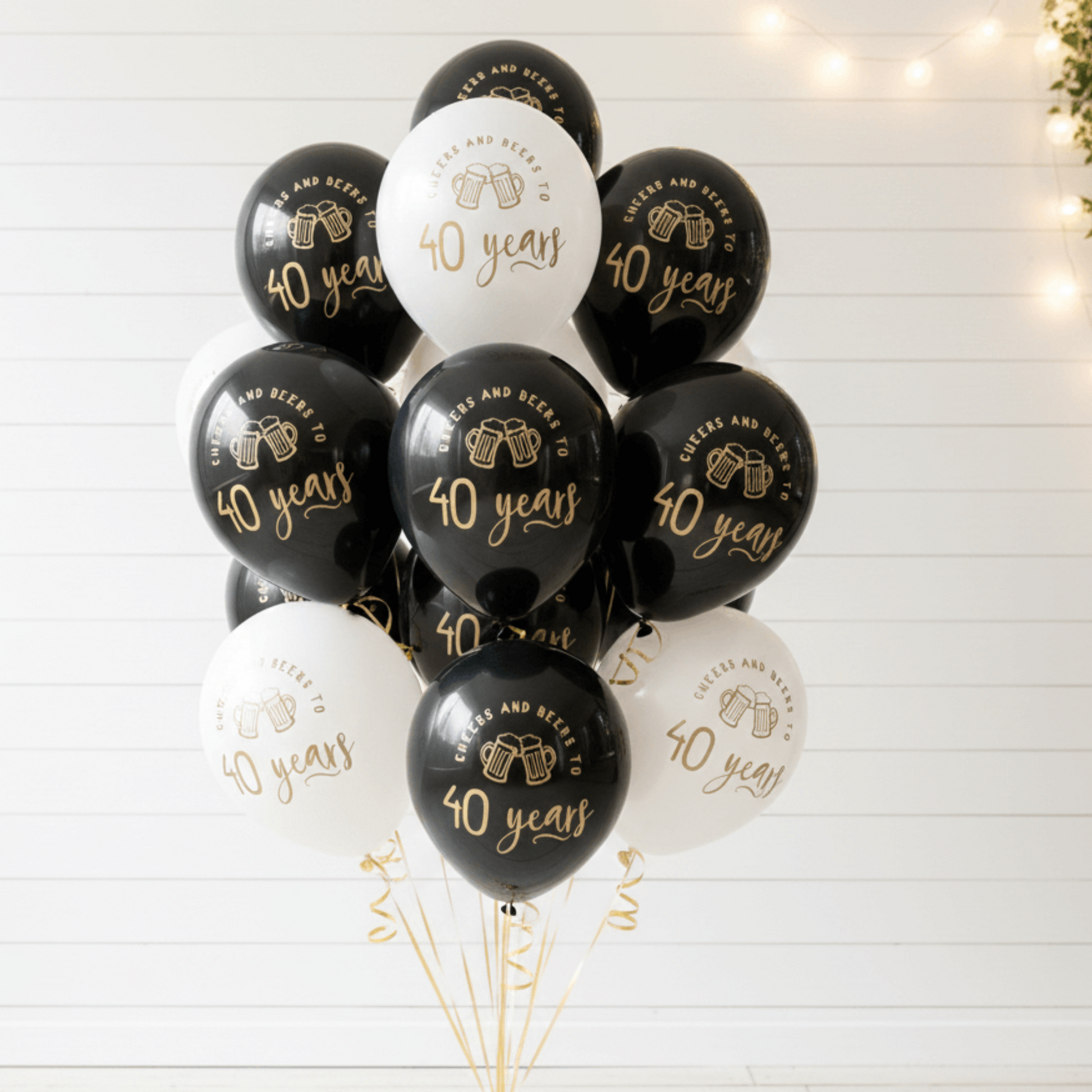 40th Birthday Balloons Bouquet of black and white balloons with 'cheers and beers to 40 years' text on a white background