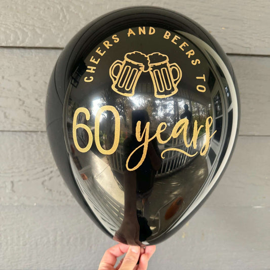 Cheers and Beers to 60 Years balloons black with gold text 