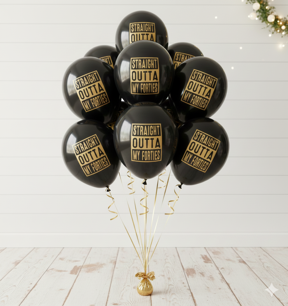 Black balloons with 'Straight Outta My Forties' text on a white wooden floor.