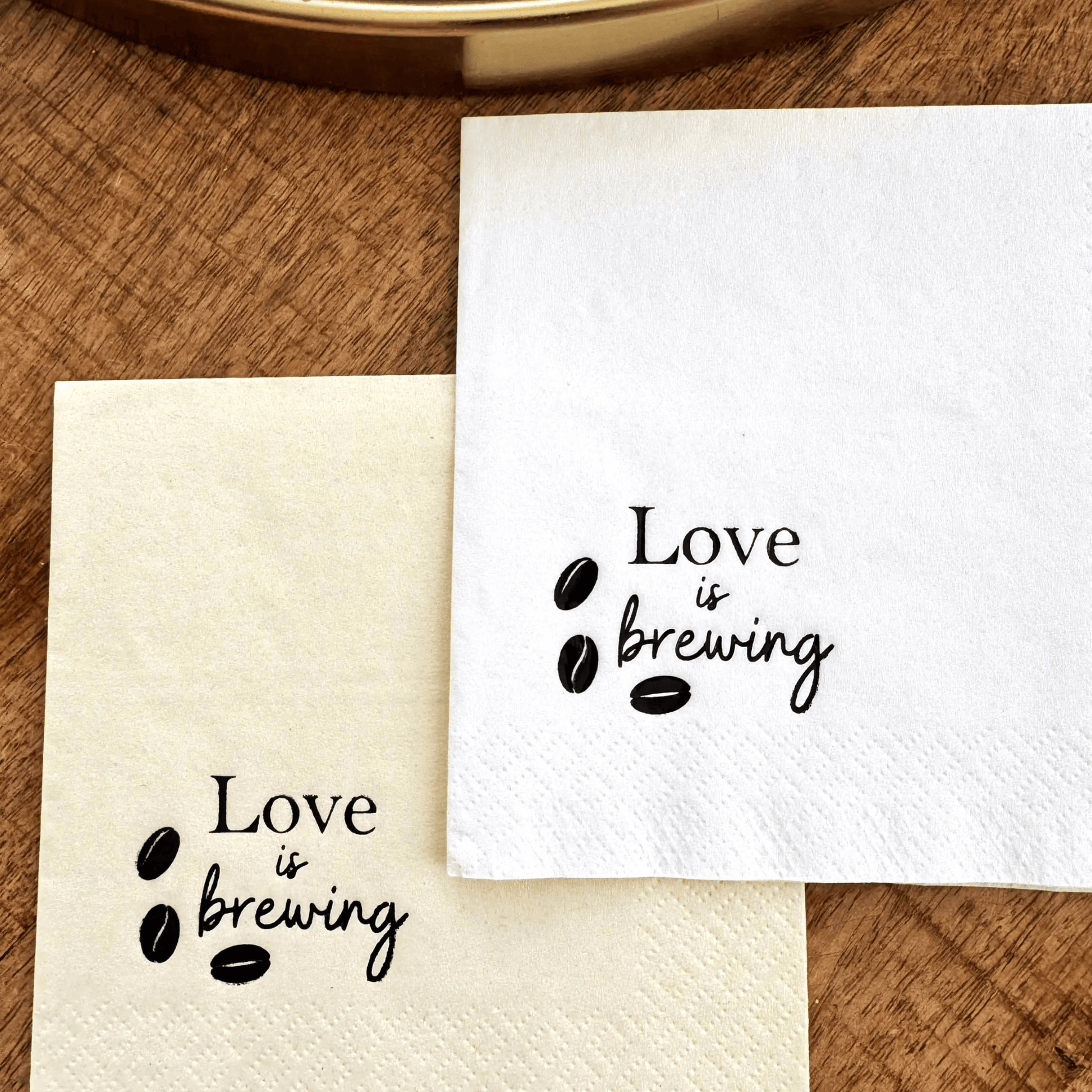 Love is brewing cocktail napkins stamped in a black foil with coffee beans