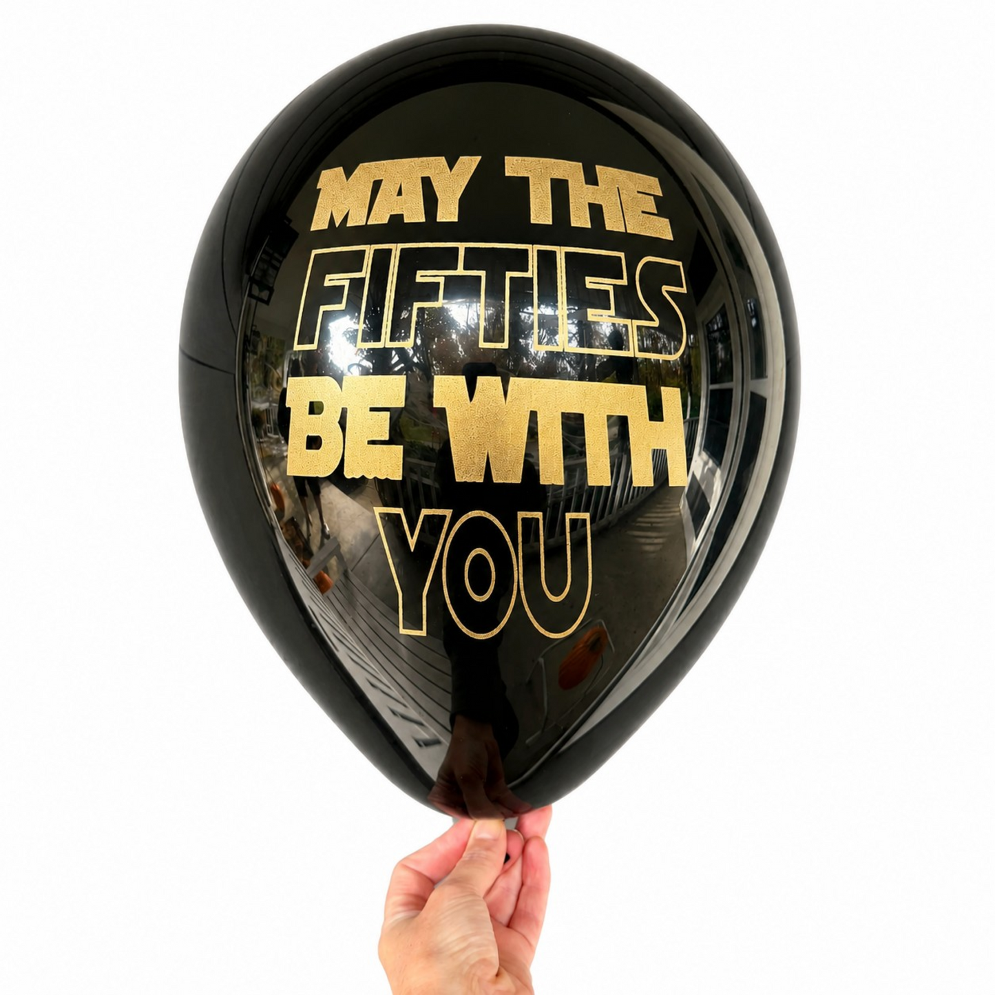 50th Birthday Balloons.   glossy black balloon with gold foil text reading 'MAY THE FIFTIES BE WITH YOU',.  Perfect 50th Birthday Decorations.