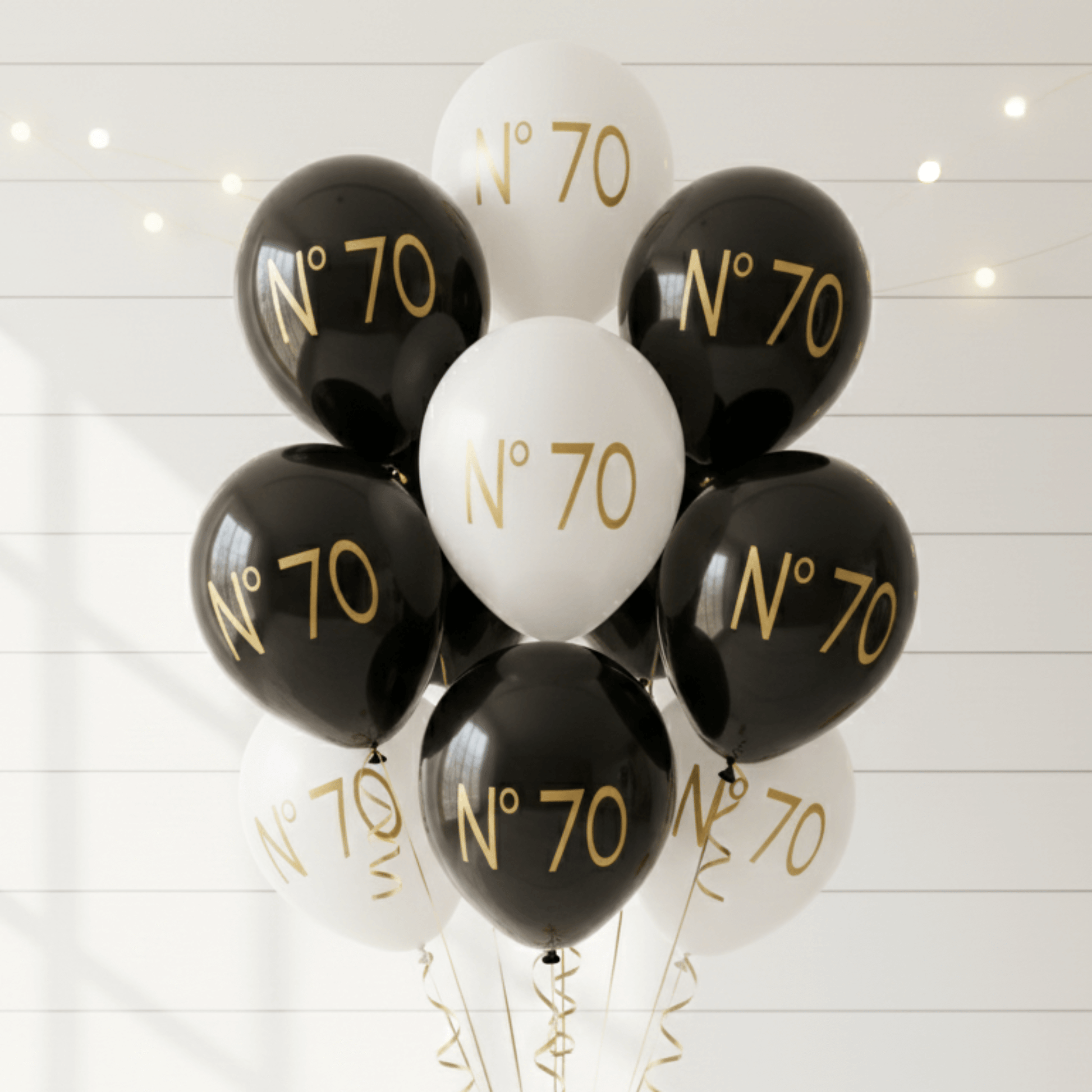 No 70 couture balloons black and white with gold text