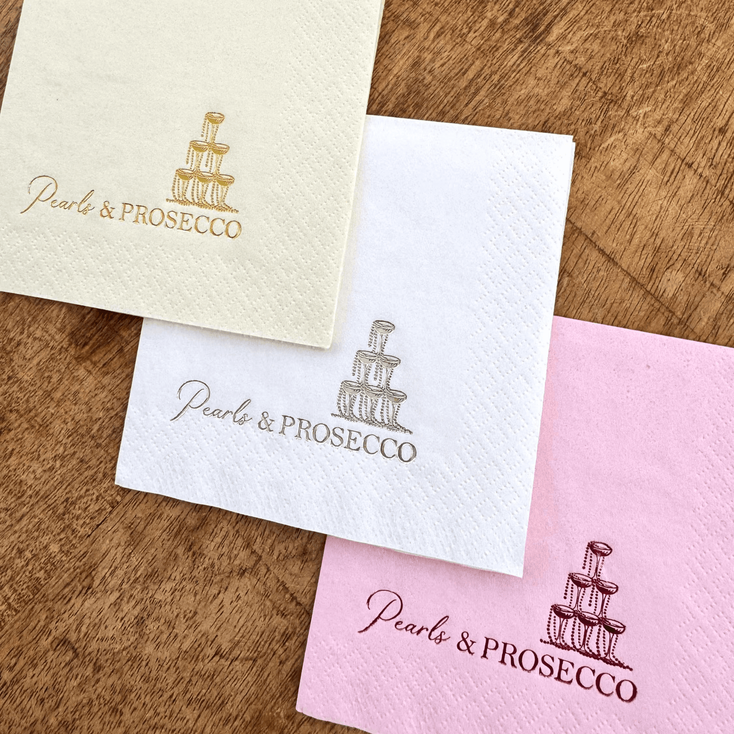 Pearls and Prosecco Cocktail napkins that are stamped in different color foils