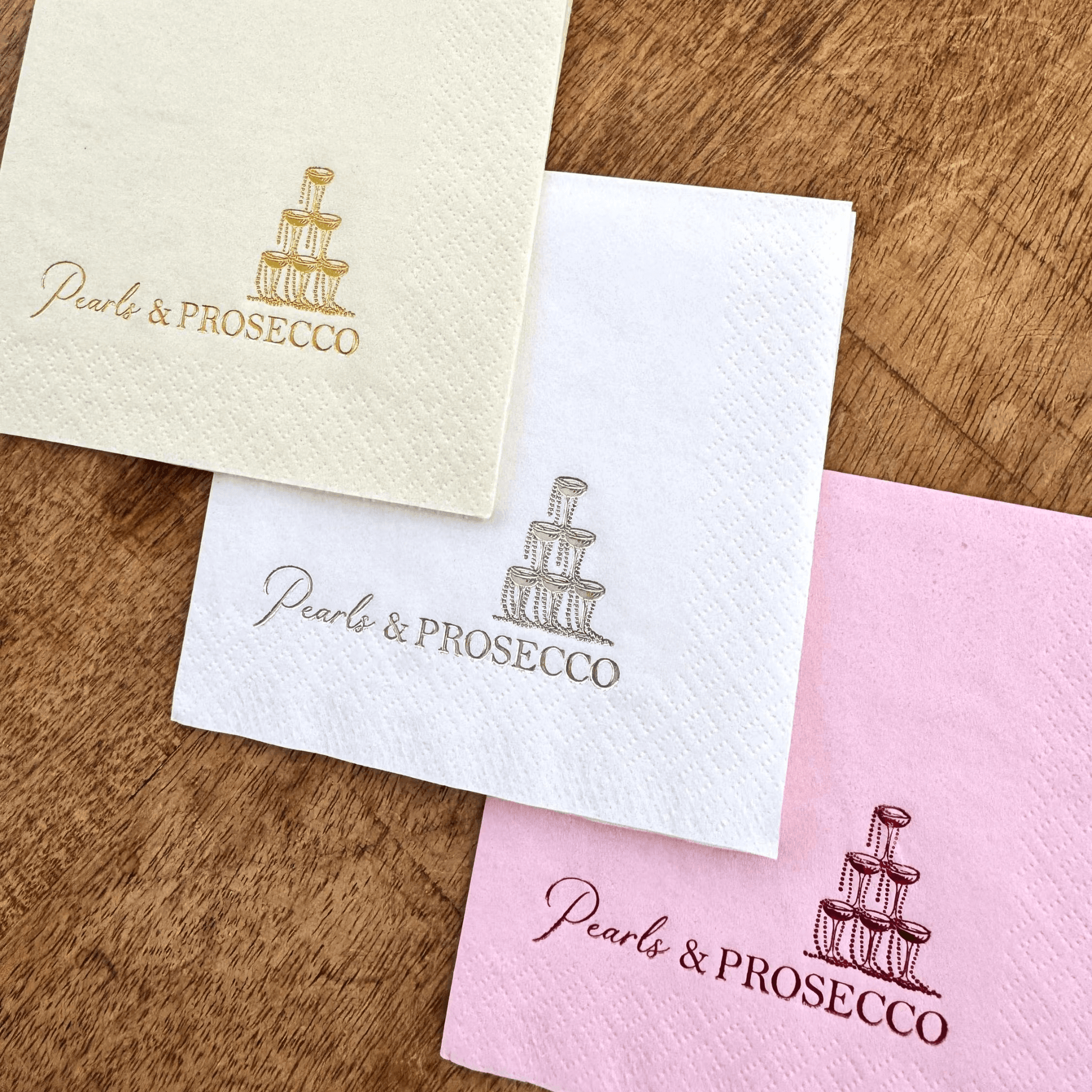Pearls and Prosecco Cocktail napkins that are stamped in different color foils