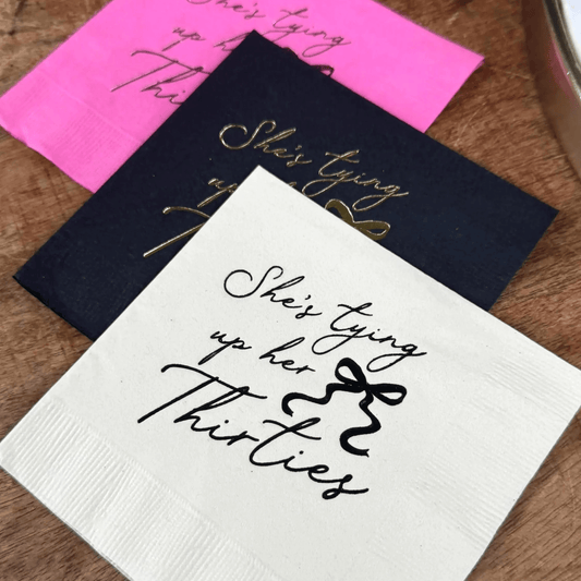 She’s Tying Up Her Thirties cocktail napkins foil stamped