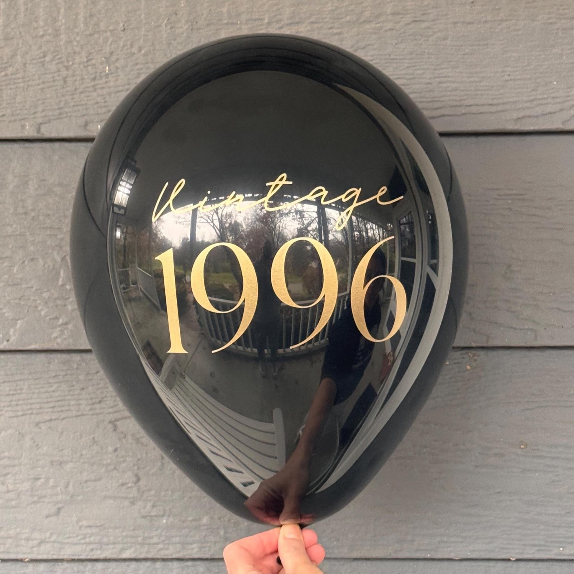 Black latex balloon that reads Vintage 1996 in gold font.  30th Birthday Decorations