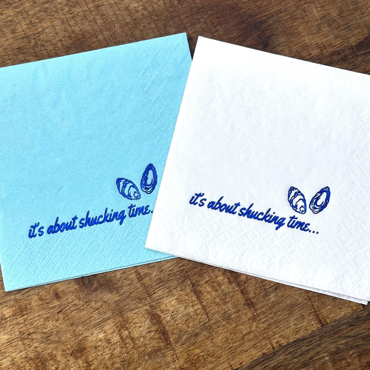 Bachelorette Foil Stamped Cocktail Napkins.  The napkins read It's About Shucking Time with two Oyster Shells.  These napkins are perfect for a Coastal Wedding or an Ocean Themed Bachelorette, Last Toast on the Coast