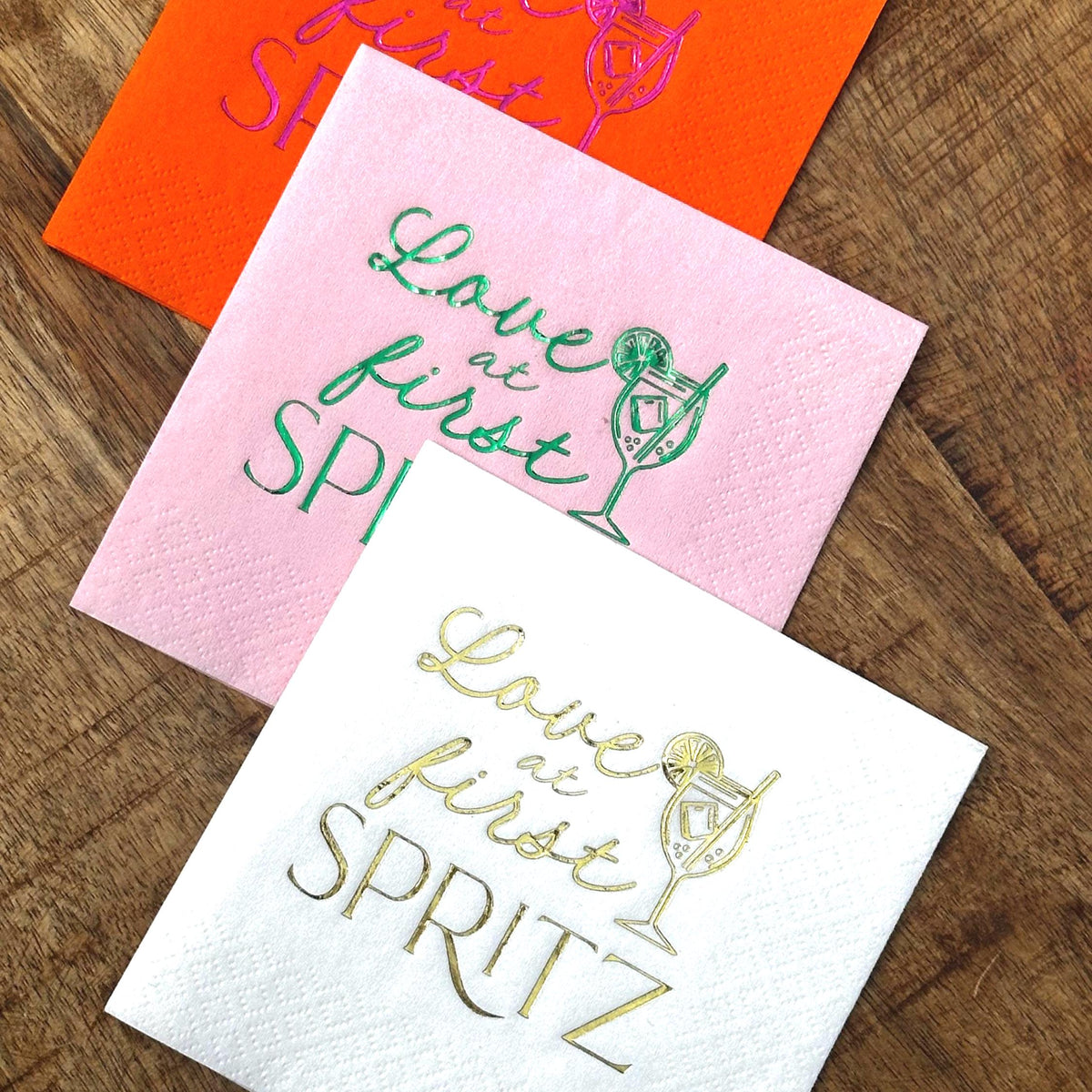 Love at first Spritz Cocktail Napkins.  These napkins feature an Aperol Spritz.  Perfect decorations for a bridal shower, bachelorette or engagement party.  Napkins are stamped in various color of foils.