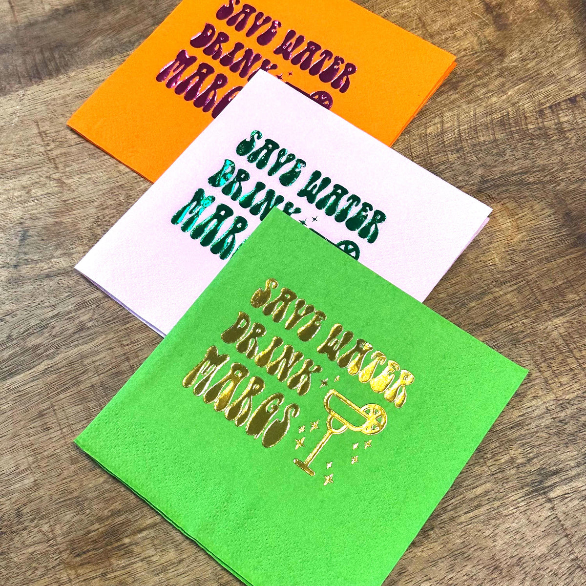 Save Water Drink Margs Cocktail napkins.  These napkins are stamped in foil and show a margarita in a vintage flair.  Perfect for Bachelorettes, Pool Parties, and other Margarita inspired festivities.