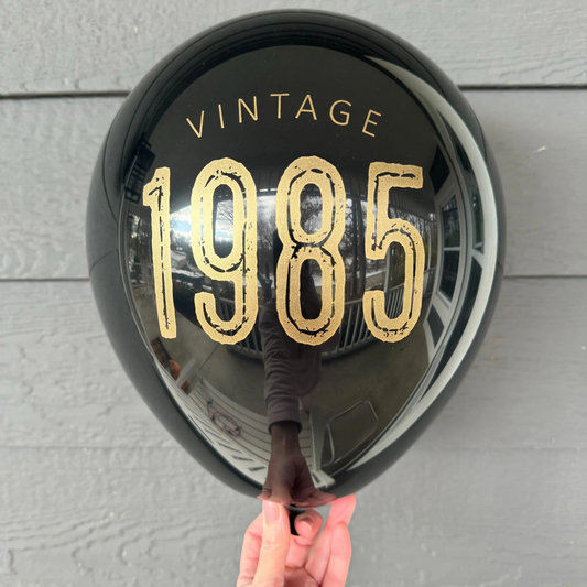 Vintage 1985 Balloons – Bold 40th Birthday Party Decor in White, Navy, and Black