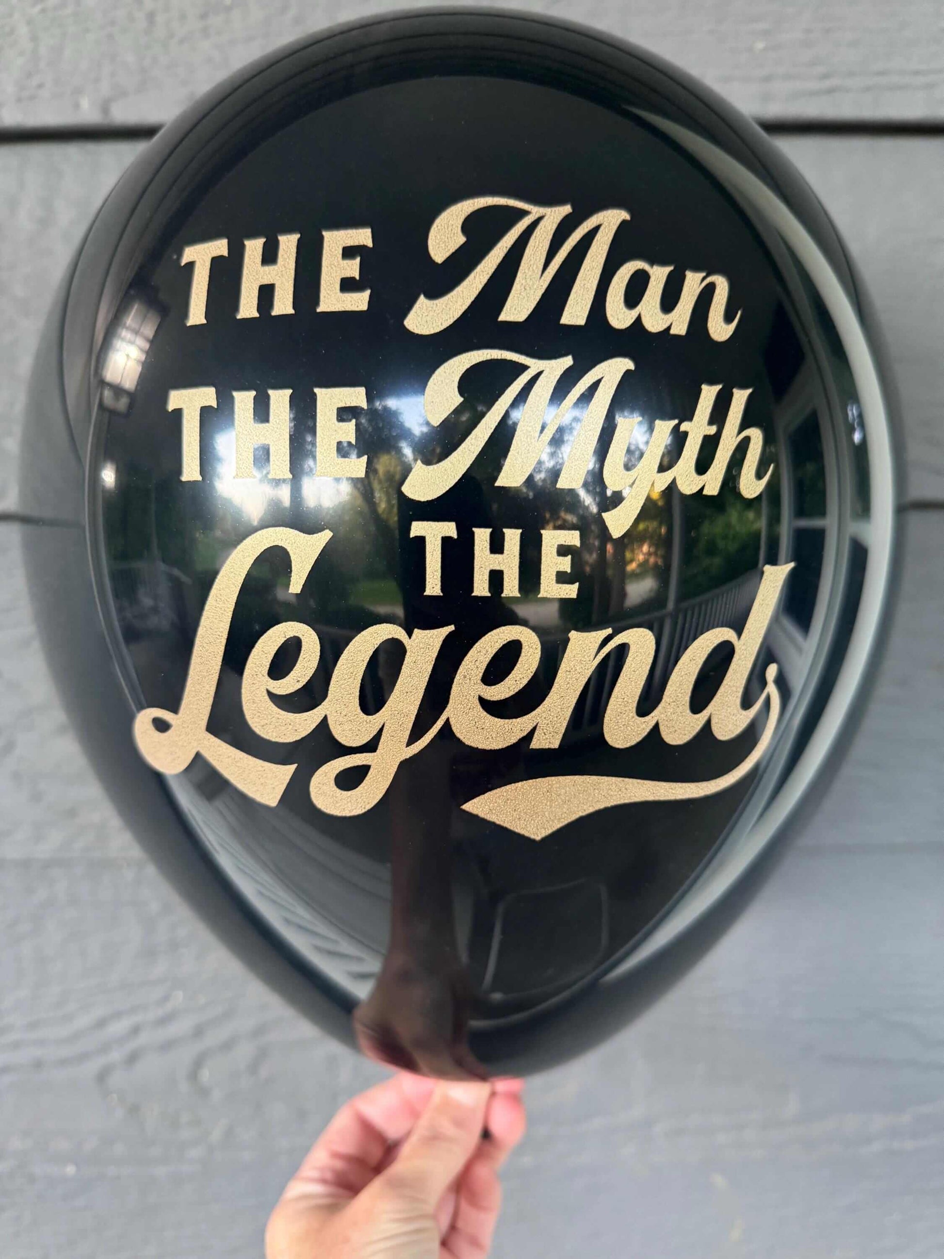 The Man The Myth The Legend balloons black and gold.  For a male birthday, retirement or milestone balloon decoration.