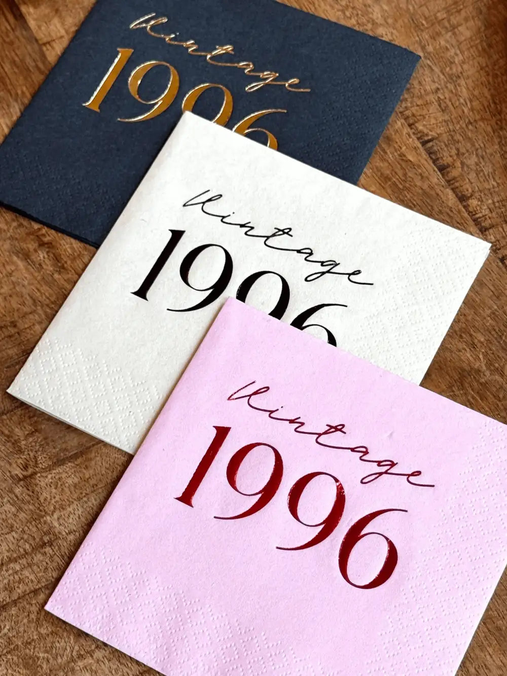 Vintage year birthday cocktail napkins for milestone party